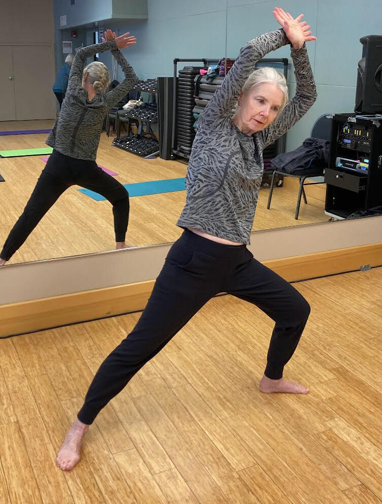 Denise in a stretch while leading Essentrics class