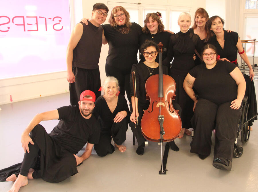 Dancers posing with cellist